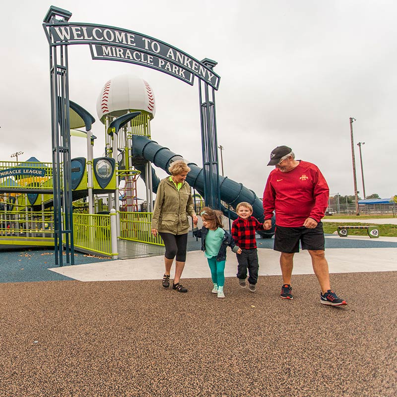 a family playing at Ankeny Miracle Park 
